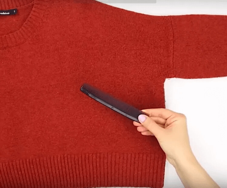 Get Fuzz Off Of Sweaters With A Comb