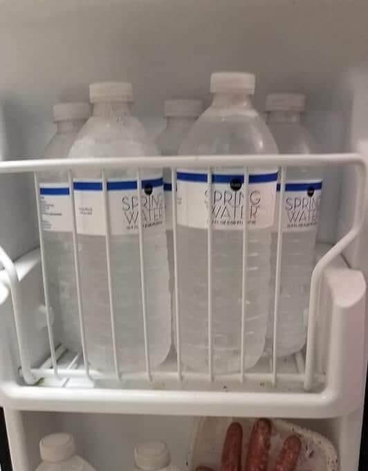 Freeze Water Bottles To Prepare For A Hurricane So The Fridge Stays Cold