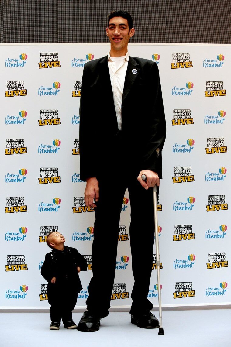 The Moment The World's Tallest and Shortest Man Met IRL